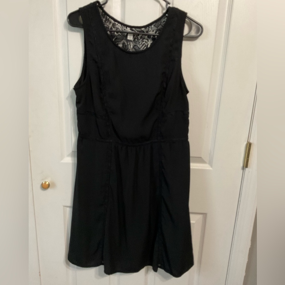 American Eagle sheath dress. Sleeveless. Black with lace detailing. Size 12